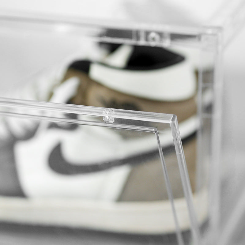 Close-up of a sneaker inside a clear SPBOX display case
